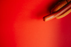 Big Hot Dog Banner on Red Background